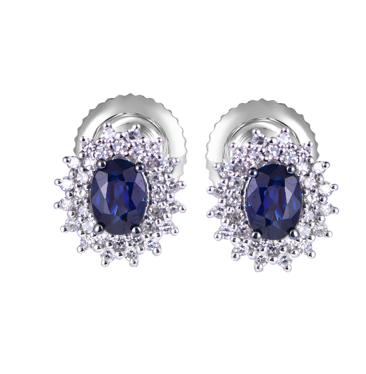 14K white gold stud earrings featuring oval blue sapphires surrounded by a halo of brilliant diamonds