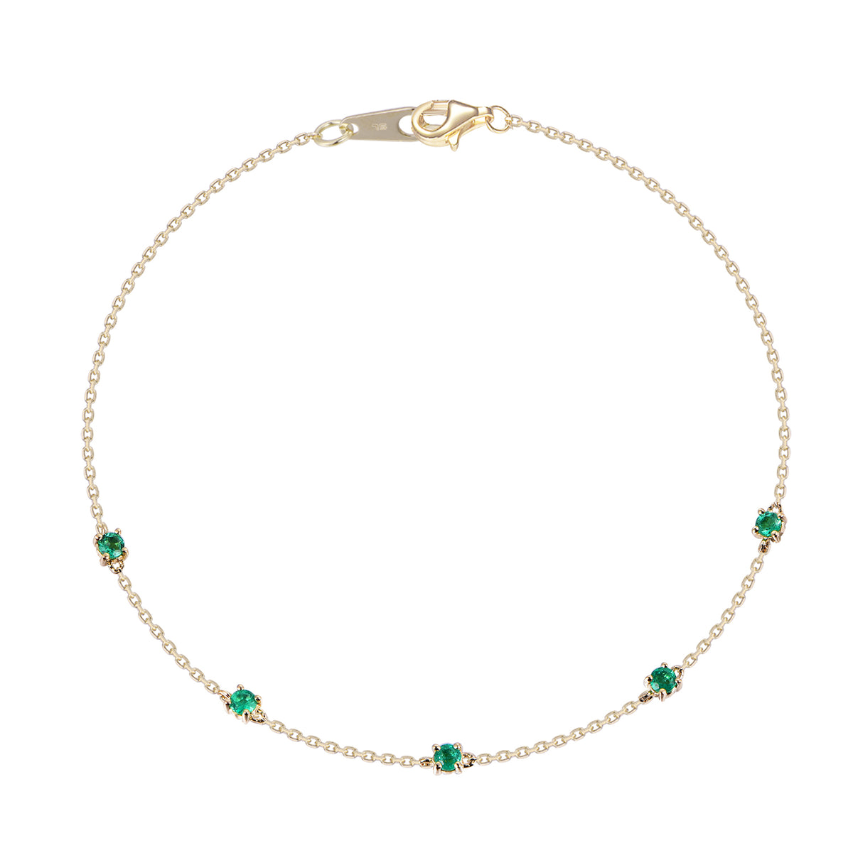 A delicate gold chain anklet featuring five small, evenly spaced emerald-cut green gemstones, displayed on a clean white background.